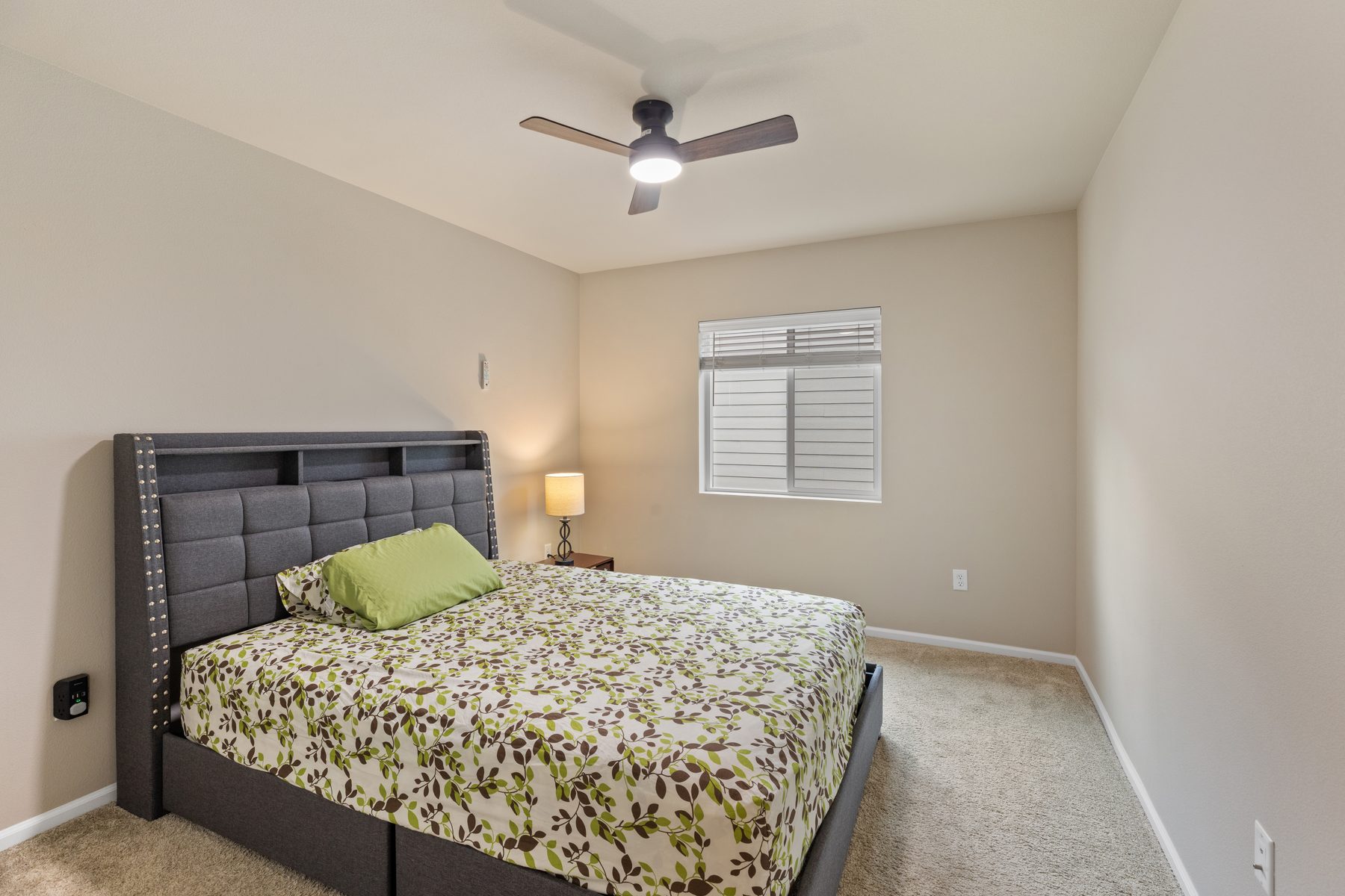 Secondary bedroom with ceiling fan